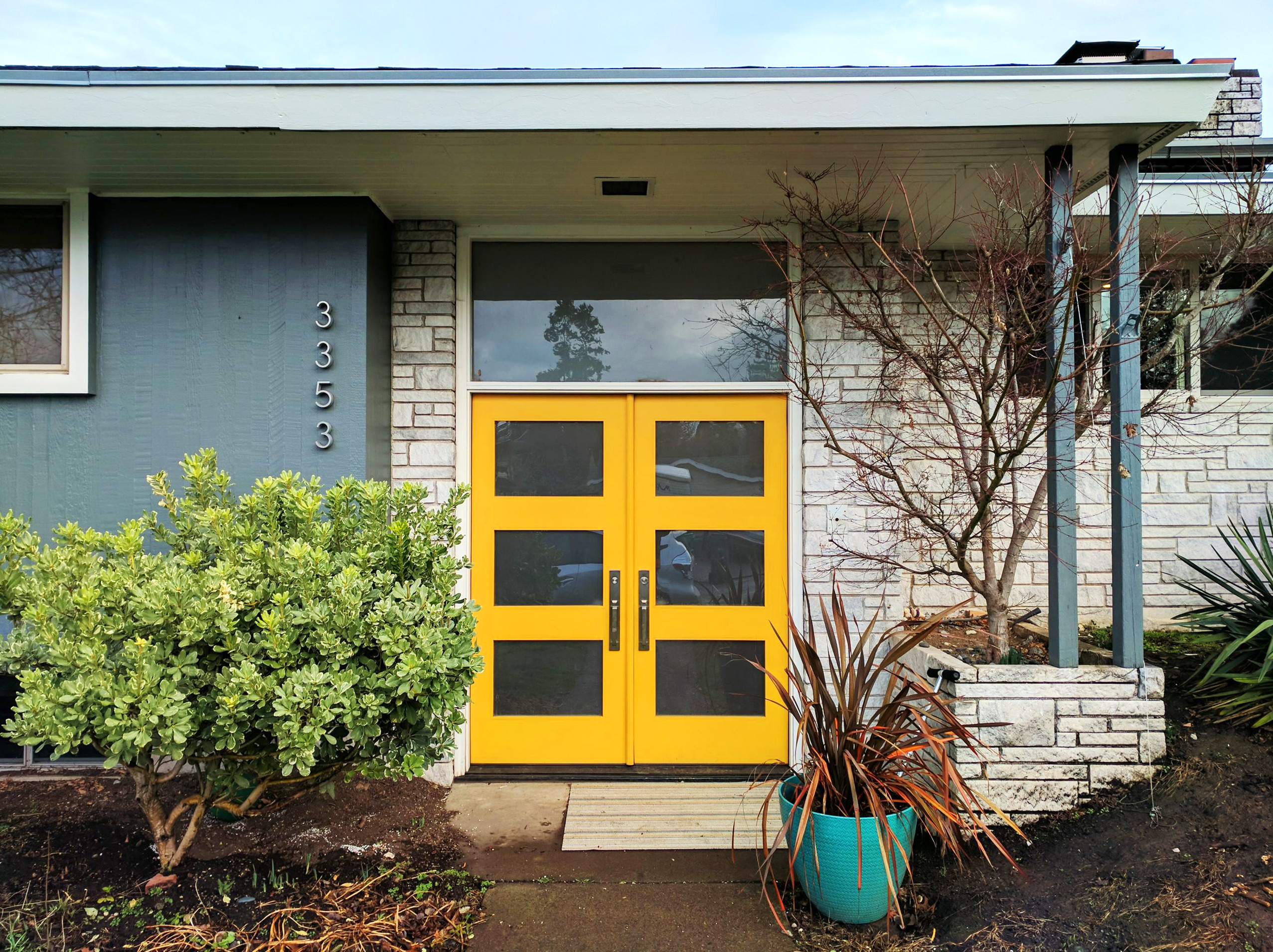 new yellow door with glass panes